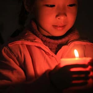 Child with a candle